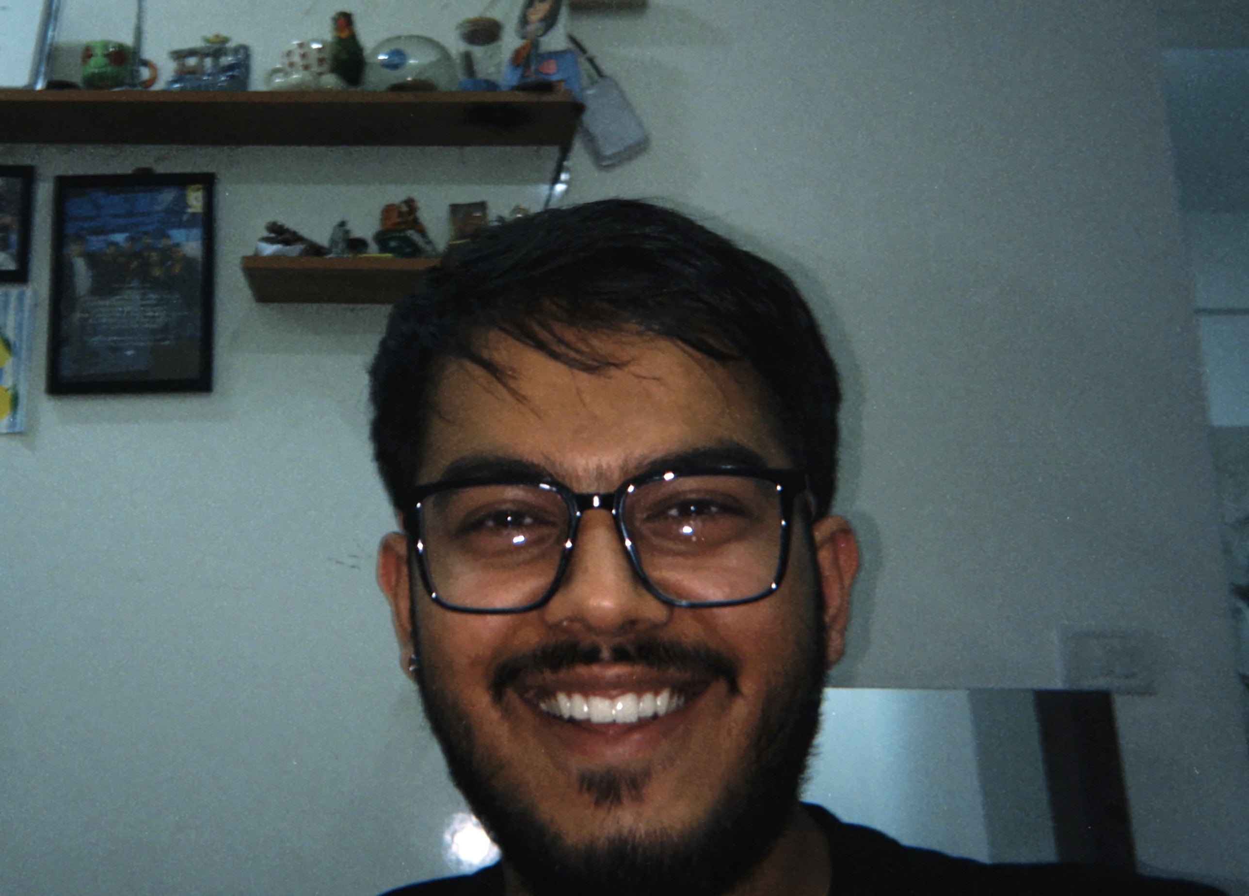 Manthan, WAY's founder, smiling at home. Hair unstyled: fine, flat, a bit thin.